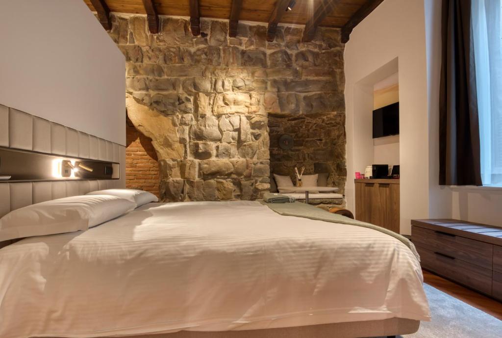 Postel nebo postele na pokoji v ubytování Le Torri Suites