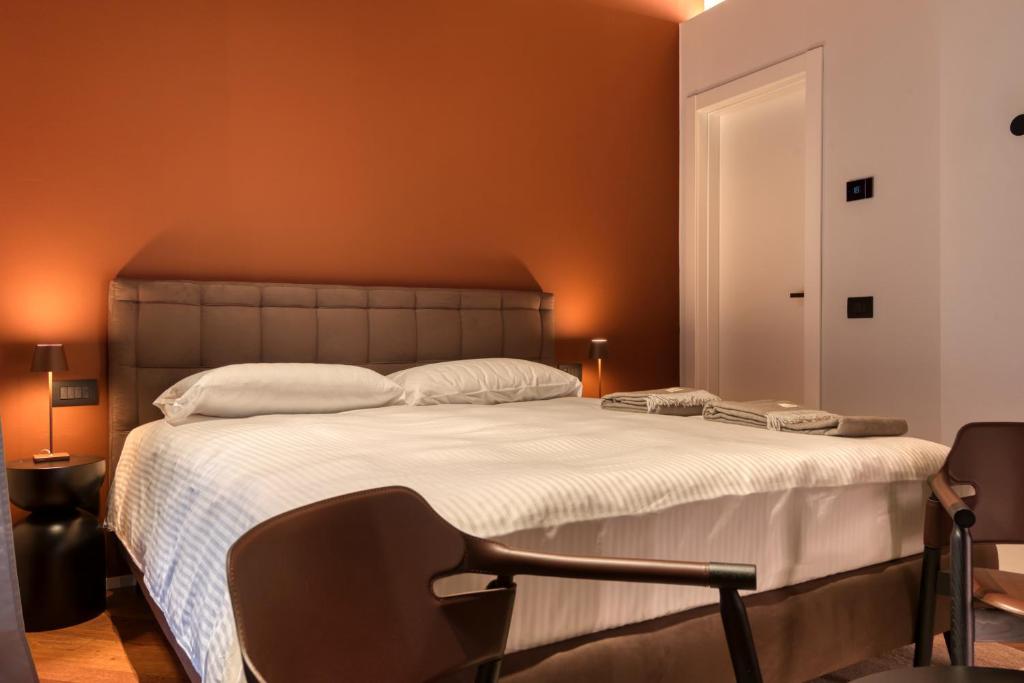 Postel nebo postele na pokoji v ubytování Le Torri Suites