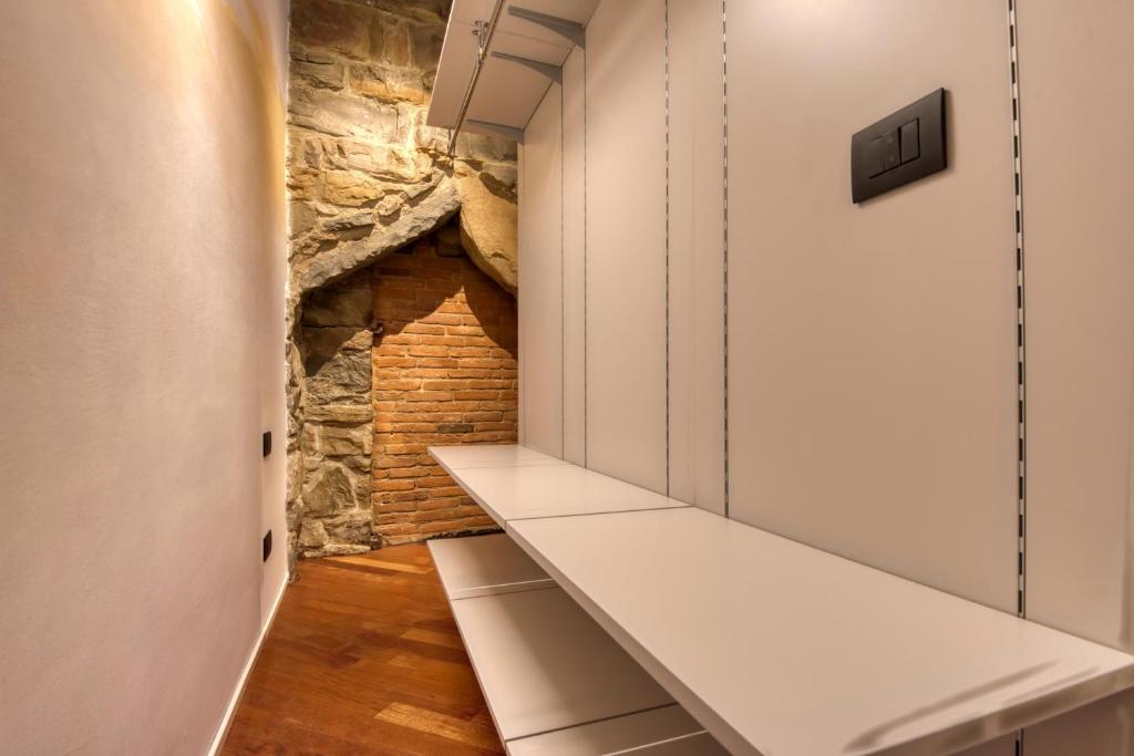 TV a/nebo společenská místnost v ubytování Le Torri Suites