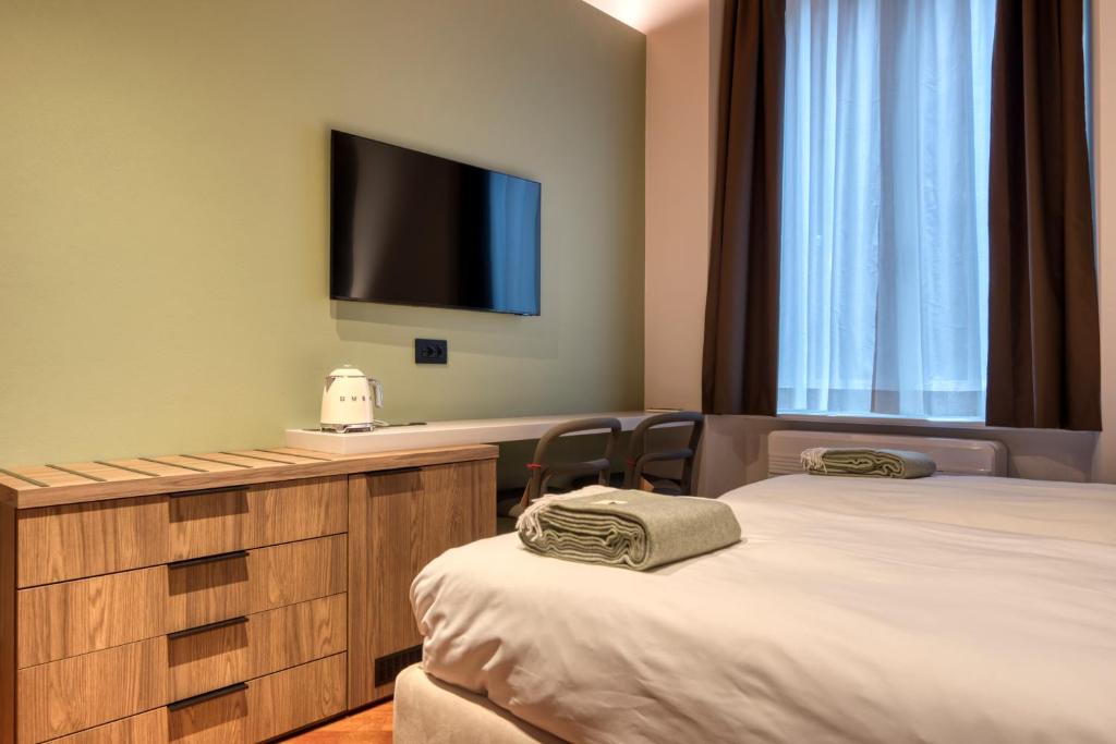 Postel nebo postele na pokoji v ubytování Le Torri Suites