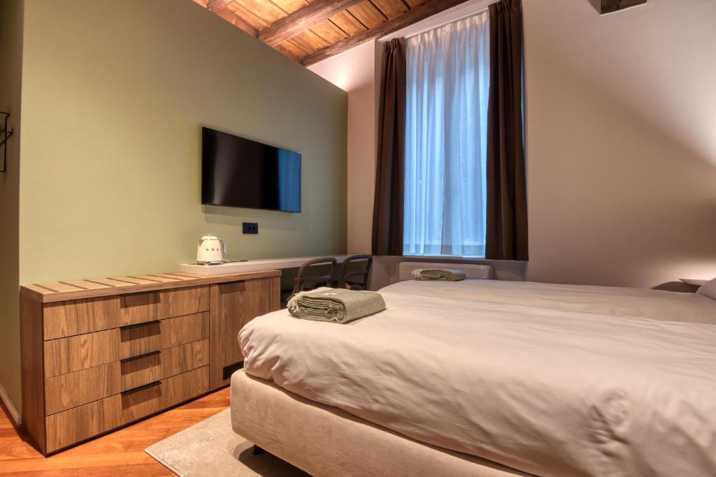 Postel nebo postele na pokoji v ubytování Le Torri Suites