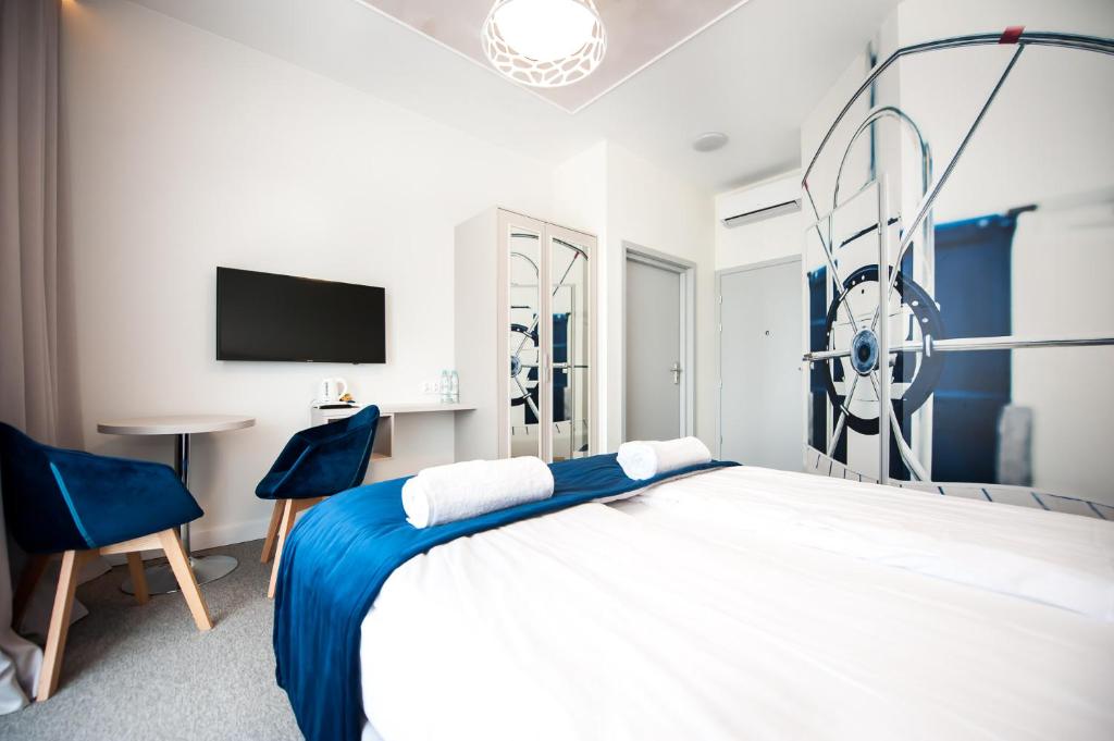 Postel nebo postele na pokoji v ubytování Hotel Gdynia Boutique