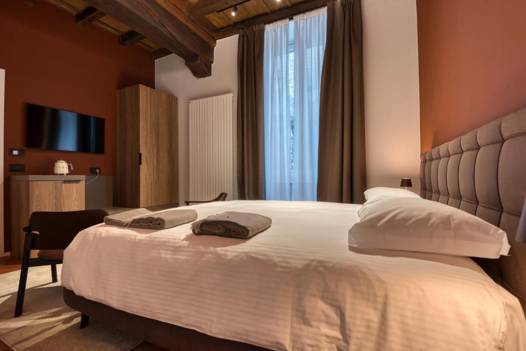 Postel nebo postele na pokoji v ubytování Le Torri Suites