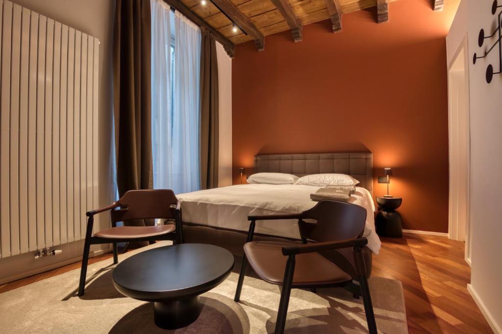 Postel nebo postele na pokoji v ubytování Le Torri Suites