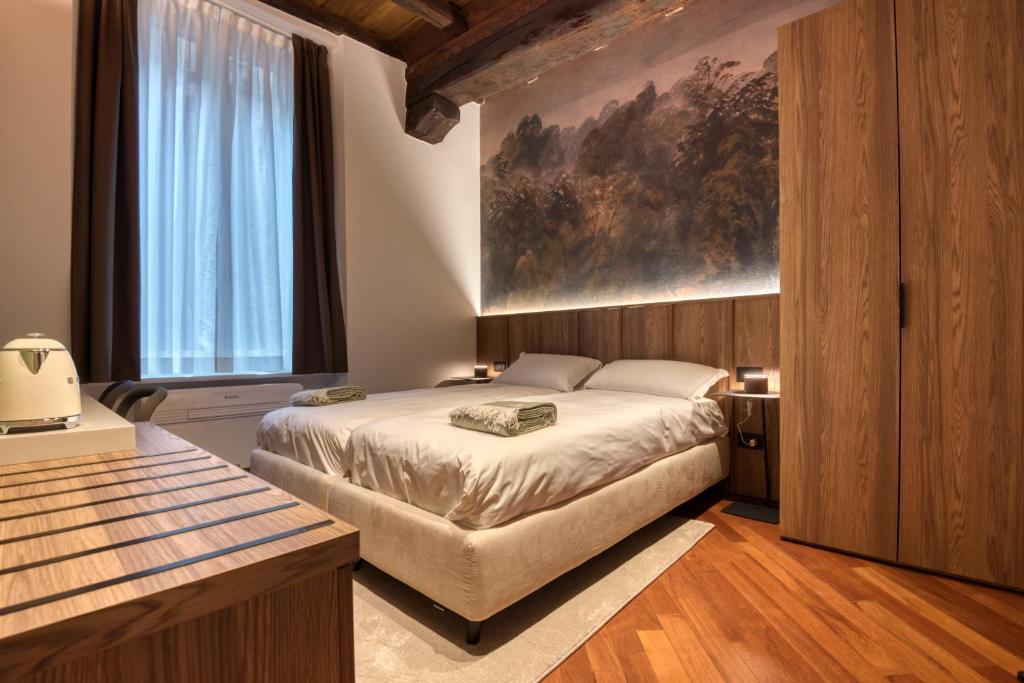 Postel nebo postele na pokoji v ubytování Le Torri Suites