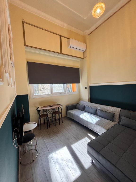 a living room with a couch and a table at City Hall Flat in Ioannina