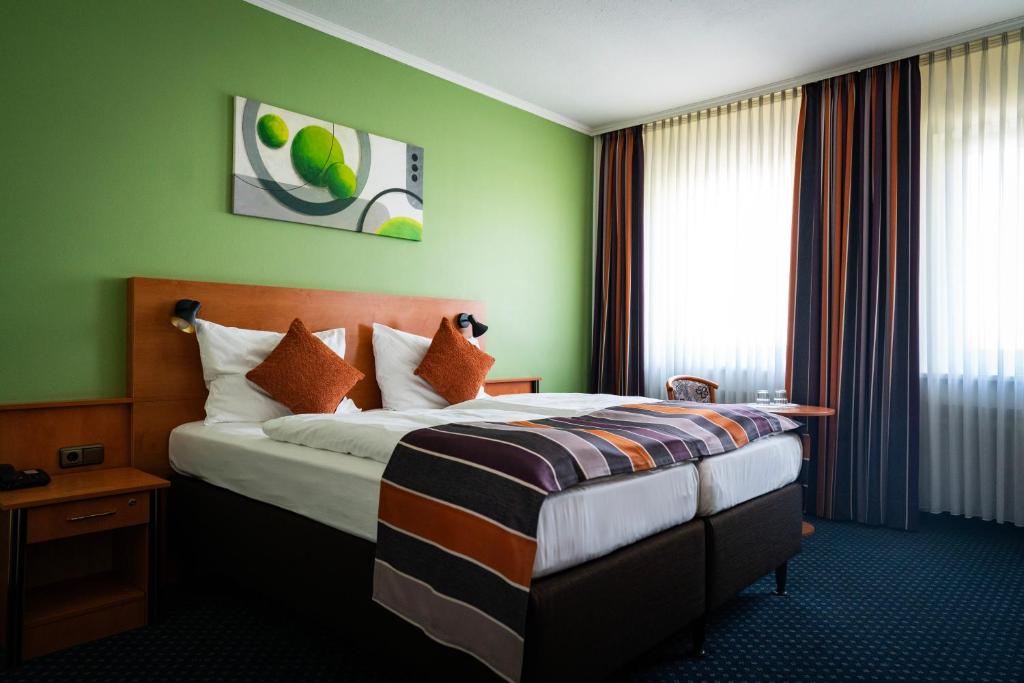 Postel nebo postele na pokoji v ubytování Hotel Boulevard
