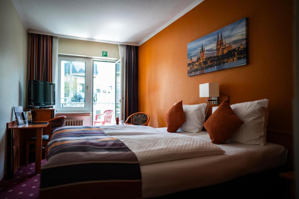 Postel nebo postele na pokoji v ubytování Hotel Boulevard