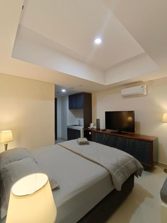 Ένα ή περισσότερα κρεβάτια σε δωμάτιο στο Bagusroom