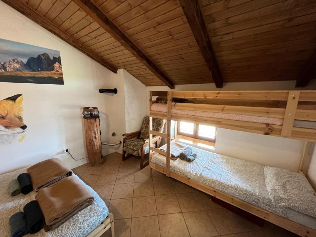 Postel nebo postele na pokoji v ubytování Rifugio Fontana Mura