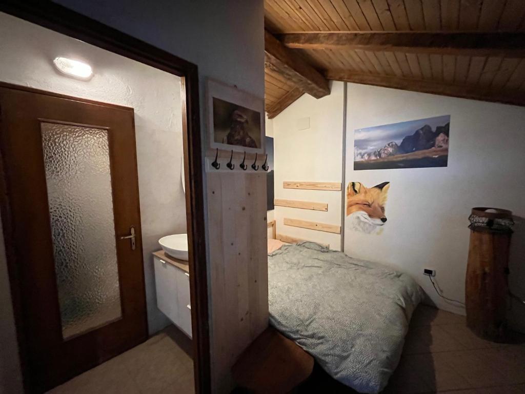 Postel nebo postele na pokoji v ubytování Rifugio Fontana Mura