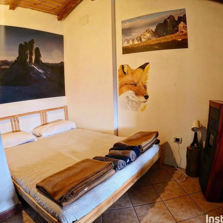 Postel nebo postele na pokoji v ubytování Rifugio Fontana Mura