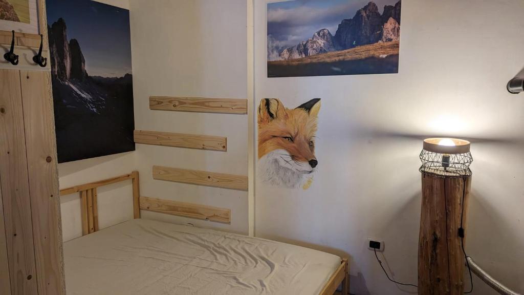 Postel nebo postele na pokoji v ubytování Rifugio Fontana Mura
