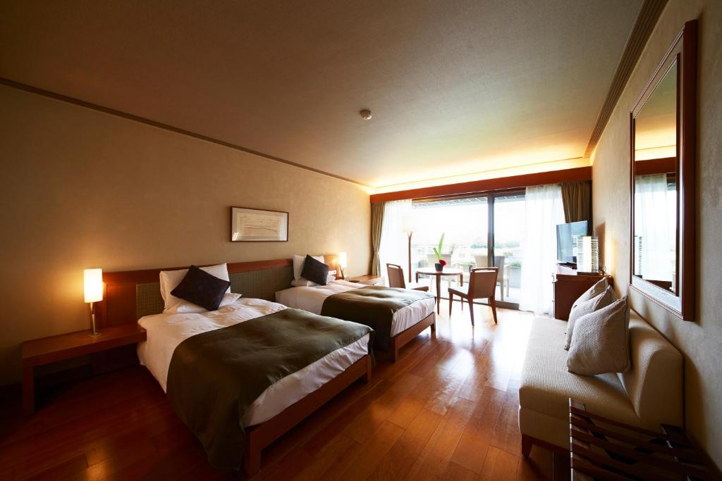 Postel nebo postele na pokoji v ubytování Hotel Anaga