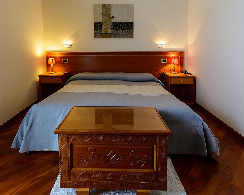 Postel nebo postele na pokoji v ubytování Hotel Del Corso