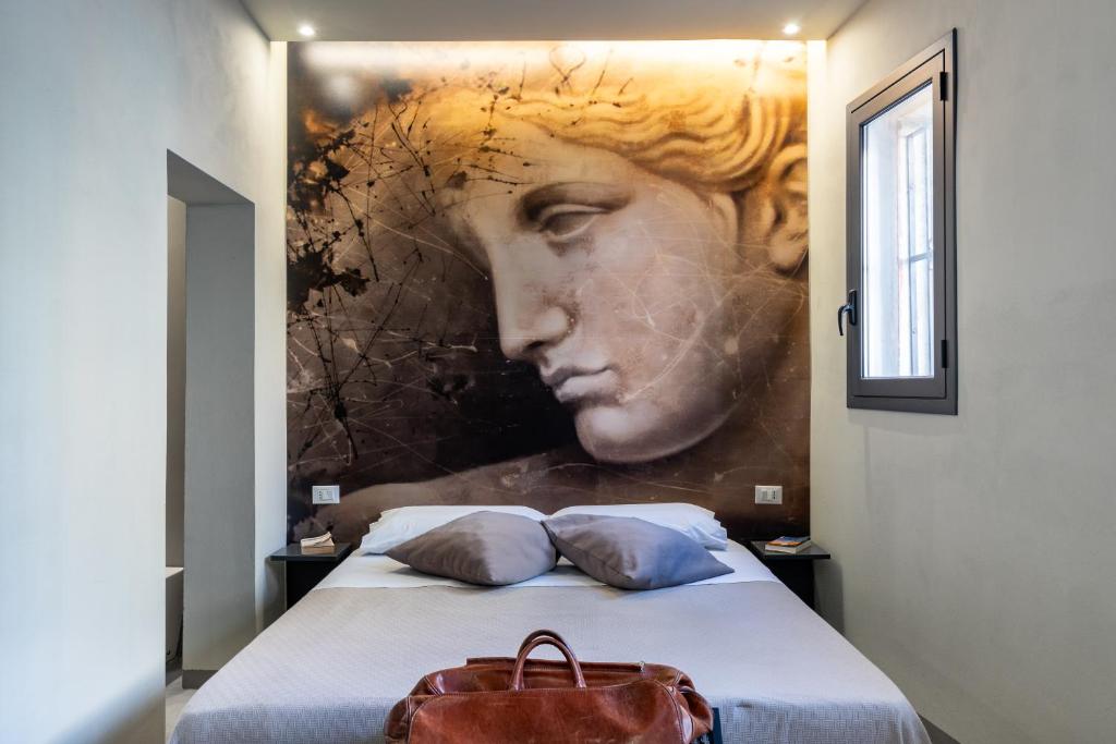 Postel nebo postele na pokoji v ubytování Dea's Rooms