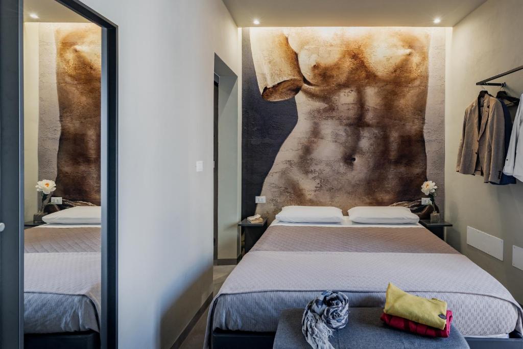 Postel nebo postele na pokoji v ubytování Dea's Rooms