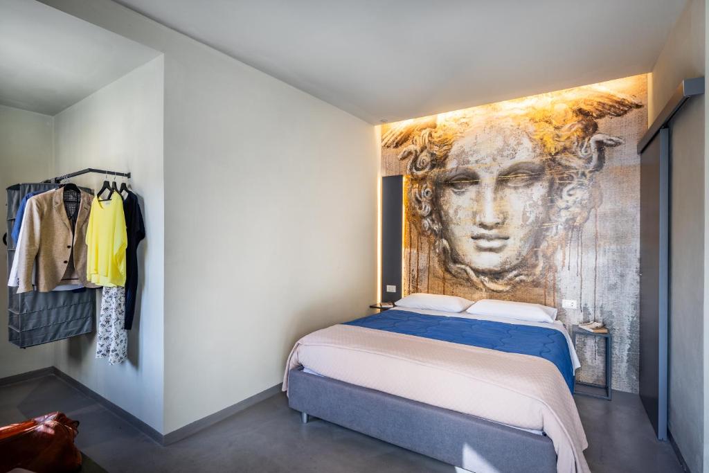Postel nebo postele na pokoji v ubytování Dea's Rooms