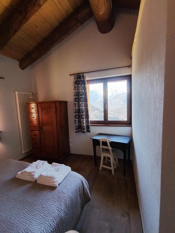 Postel nebo postele na pokoji v ubytování Rifugio Alpino Baudinet - Trek&Relax