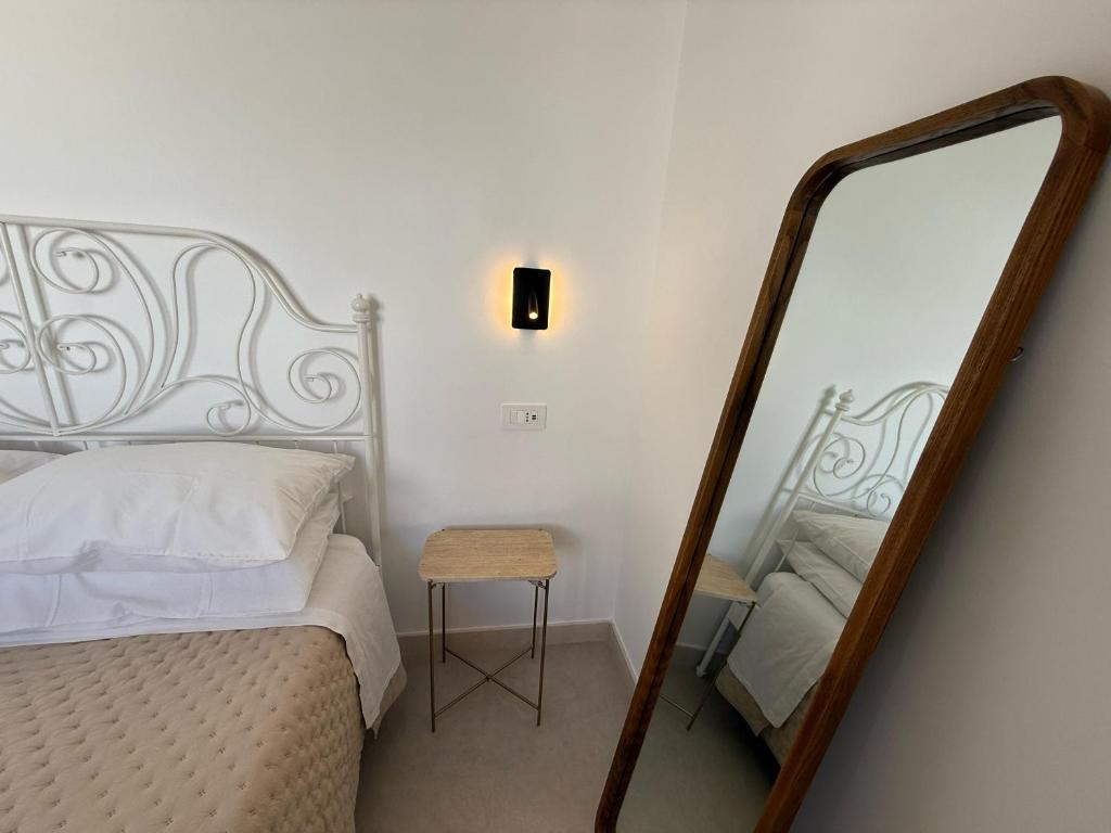 Postel nebo postele na pokoji v ubytování Buona Onda Apartments