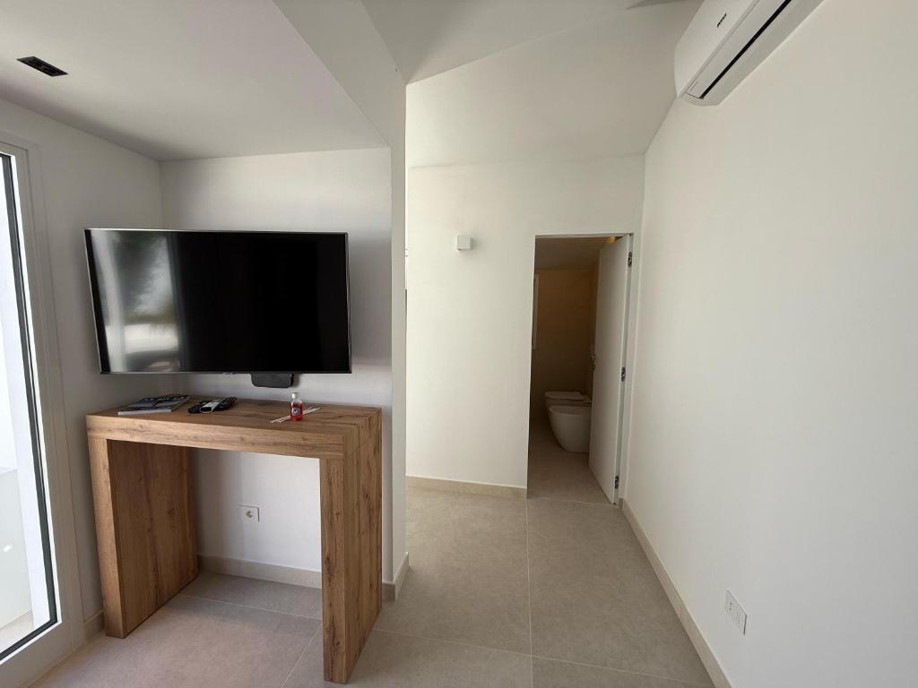 TV a/nebo společenská místnost v ubytování Buona Onda Apartments