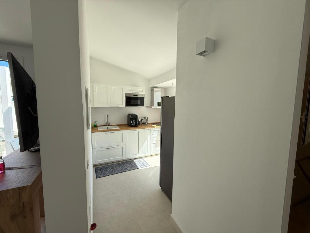 Kuchyň nebo kuchyňský kout v ubytování Buona Onda Apartments
