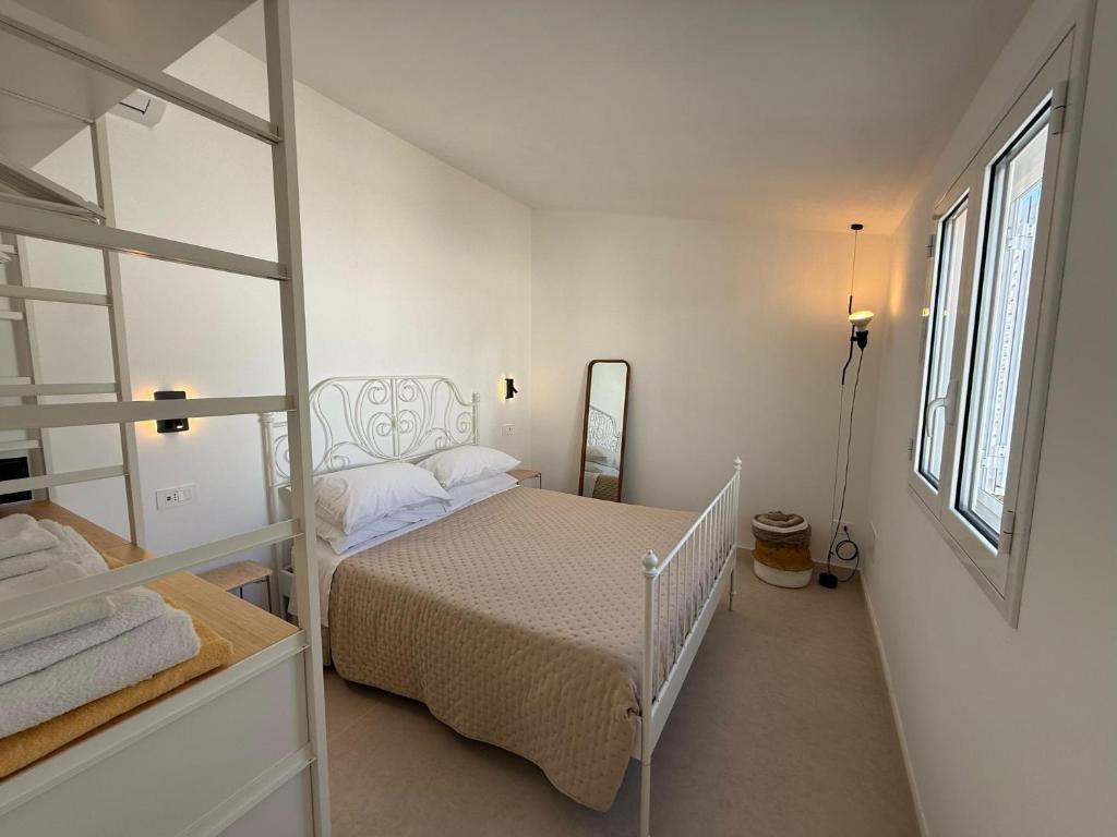 Postel nebo postele na pokoji v ubytování Buona Onda Apartments