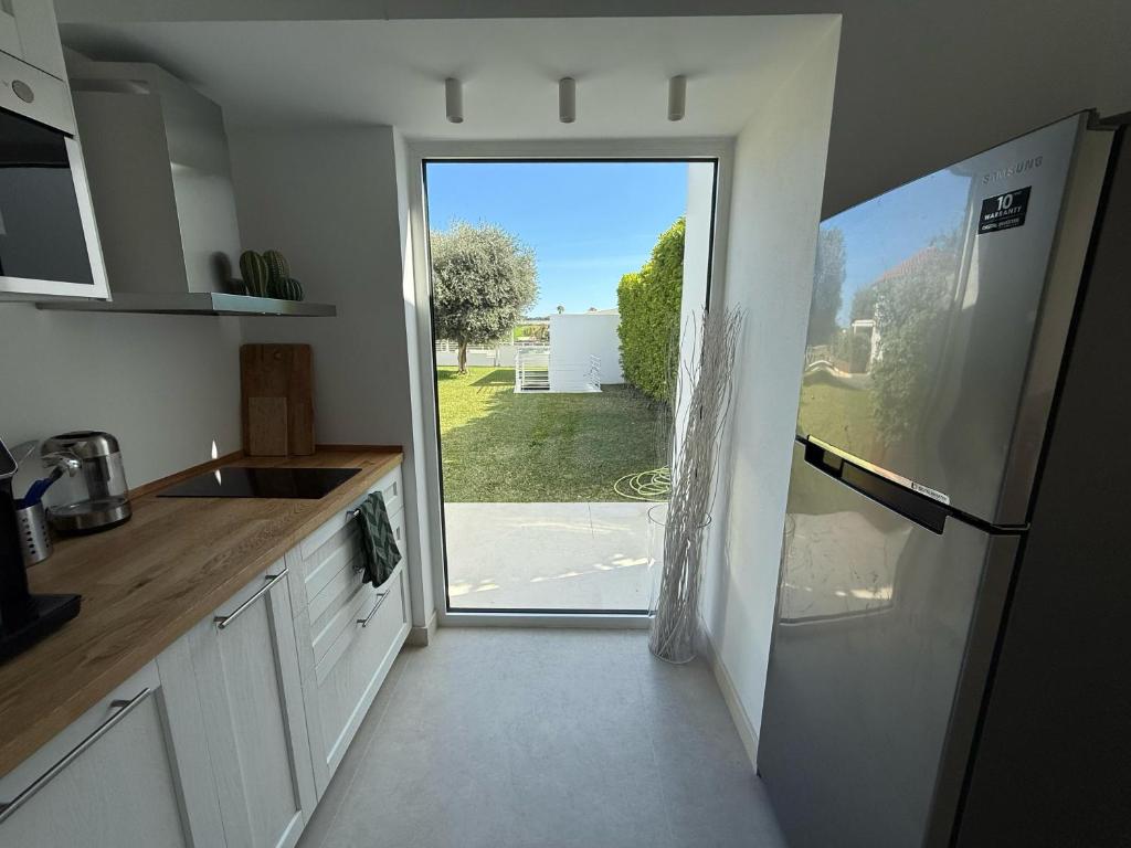 Kuchyň nebo kuchyňský kout v ubytování Buona Onda Apartments