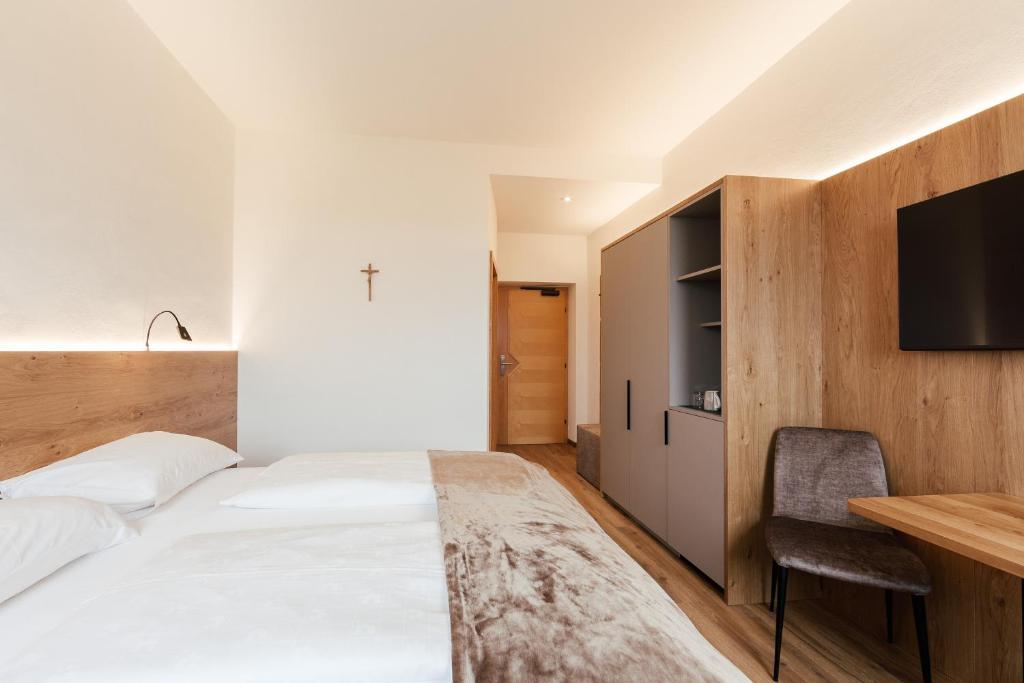 Postel nebo postele na pokoji v ubytování Gästehaus Salvatorianerinnen