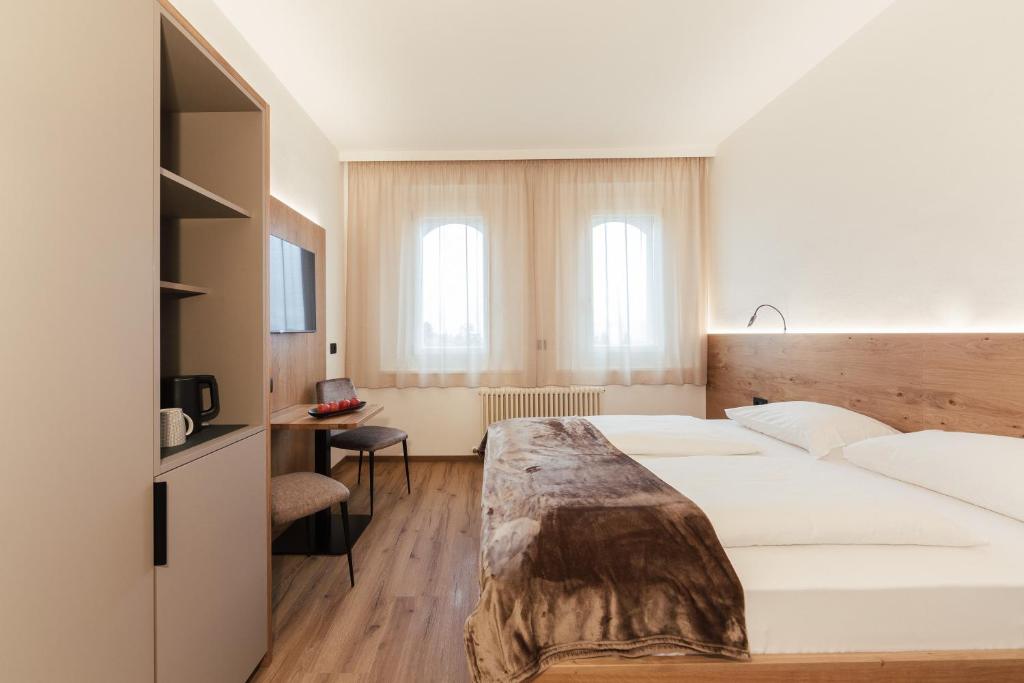 Postel nebo postele na pokoji v ubytování Gästehaus Salvatorianerinnen