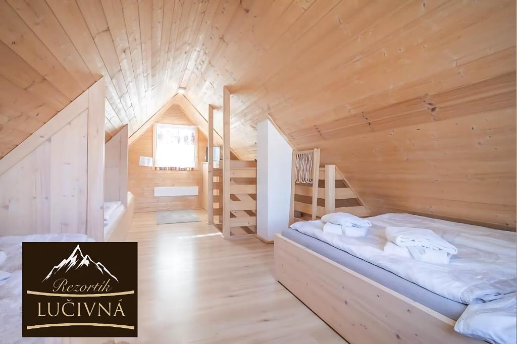 Postel nebo postele na pokoji v ubytování Rezortík Lučivná pre rodiny s deťmi, 300m od vleku, Vysoké Tatry