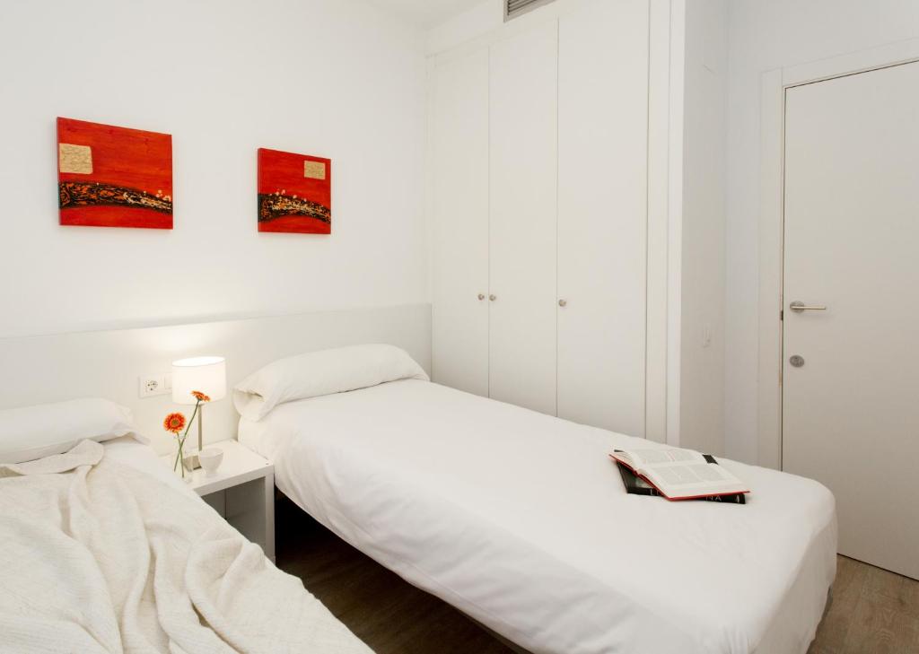 Posteľ alebo postele v izbe v ubytovaní 08028 Apartments