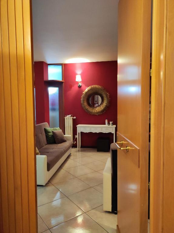 a living room with a couch and a table at Spacious 3Bedroom Apartment in Nardò, Apulia, Balcony, AC, Wi-Fi in Nardò