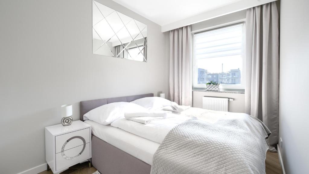 Posteľ alebo postele v izbe v ubytovaní Prywatne apartamenty Sun & Snow w Porta Mare