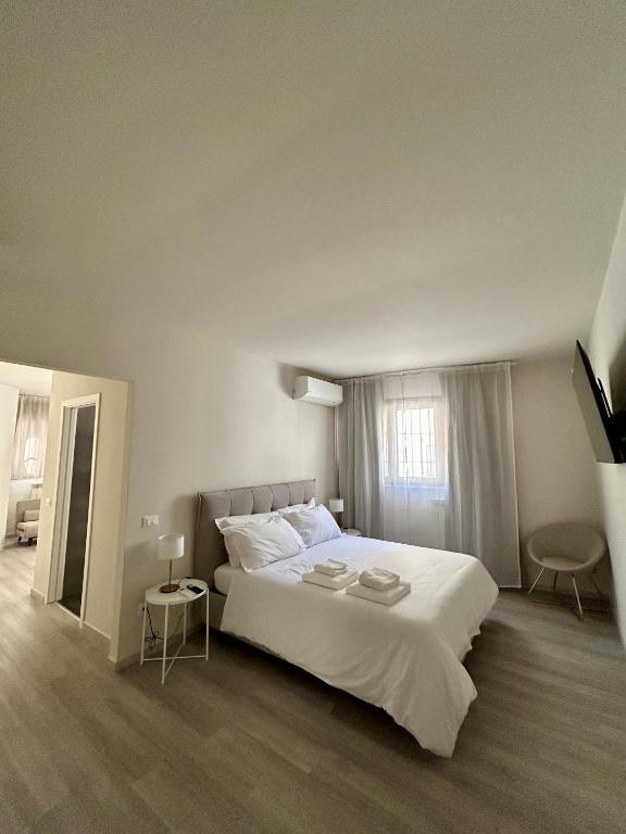 Postel nebo postele na pokoji v ubytování 7Suites