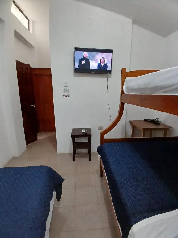 Postel nebo postele na pokoji v ubytování Veranera Hostal