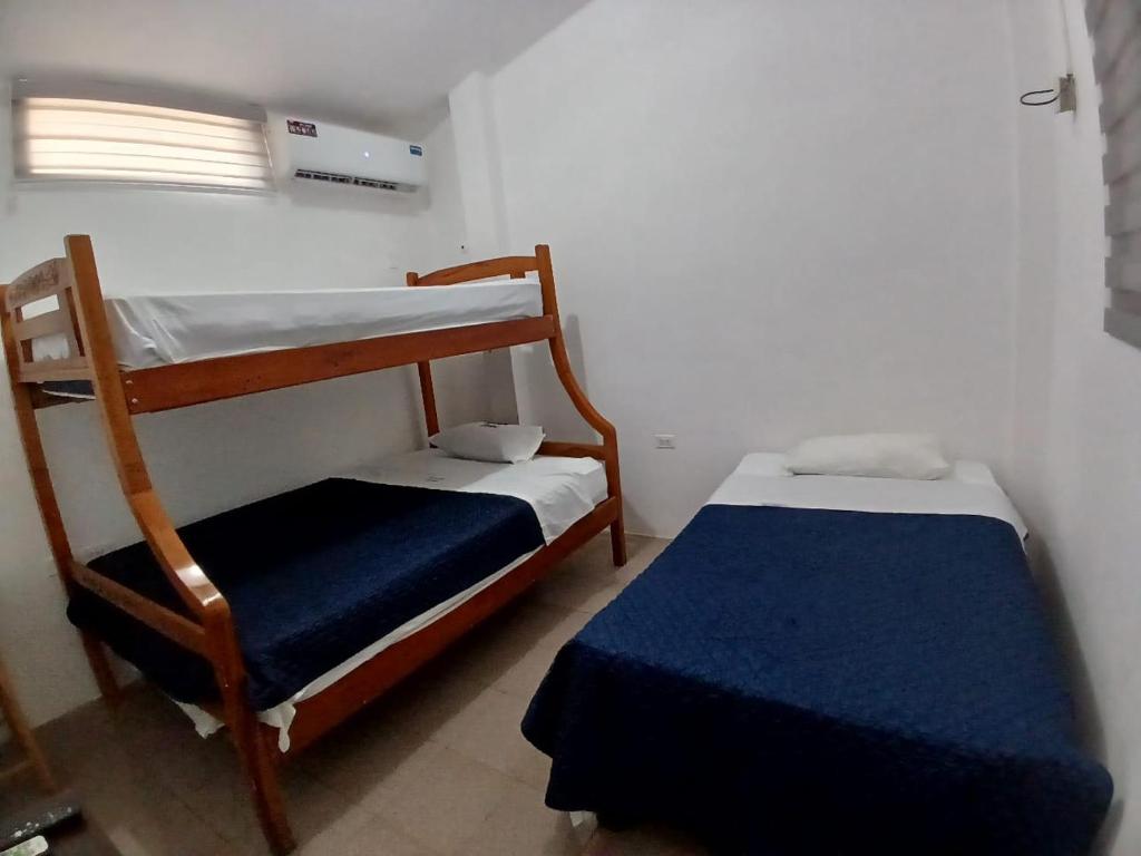 Postel nebo postele na pokoji v ubytování Veranera Hostal