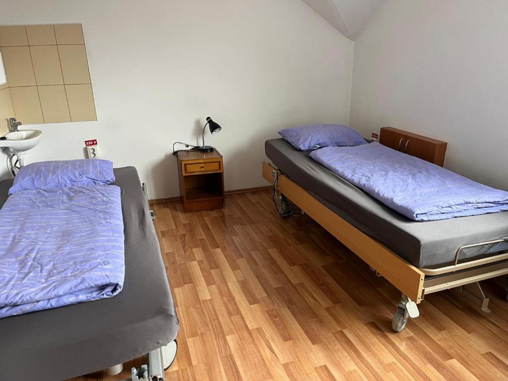 Postel nebo postele na pokoji v ubytování Rom Rems
