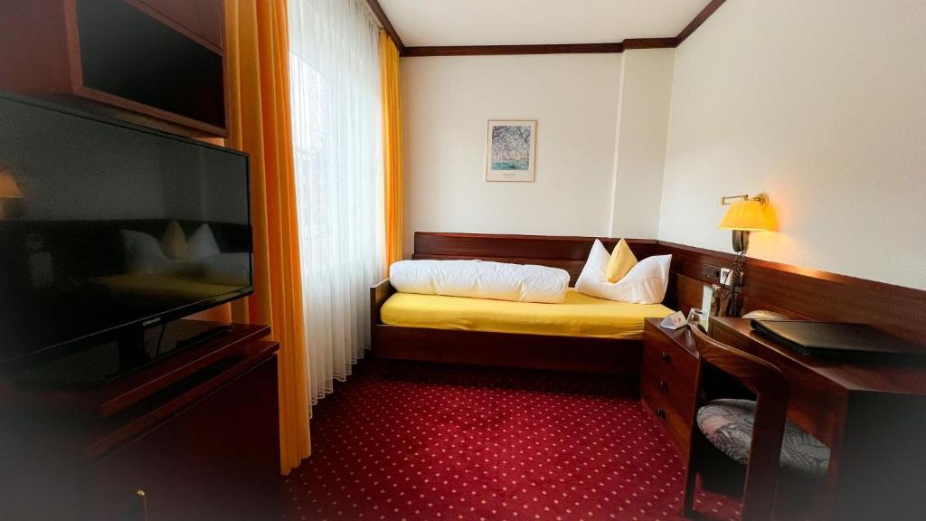 Postel nebo postele na pokoji v ubytování Kurhotel Wiedenmann