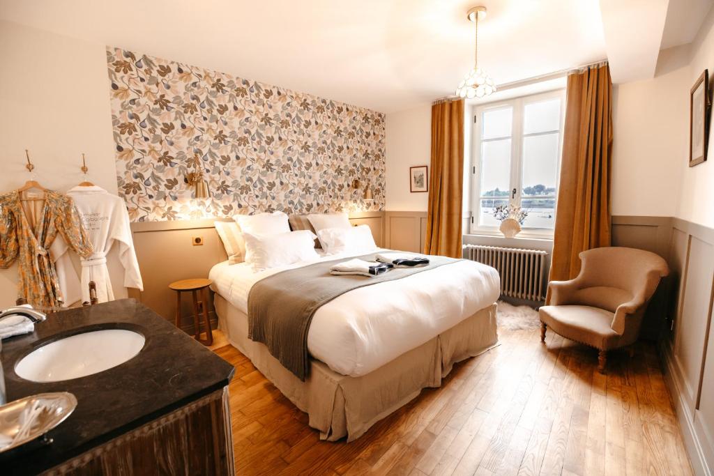 Ένα ή περισσότερα κρεβάτια σε δωμάτιο στο Villa front de mer proche St Malo ,Dinard, Dinan