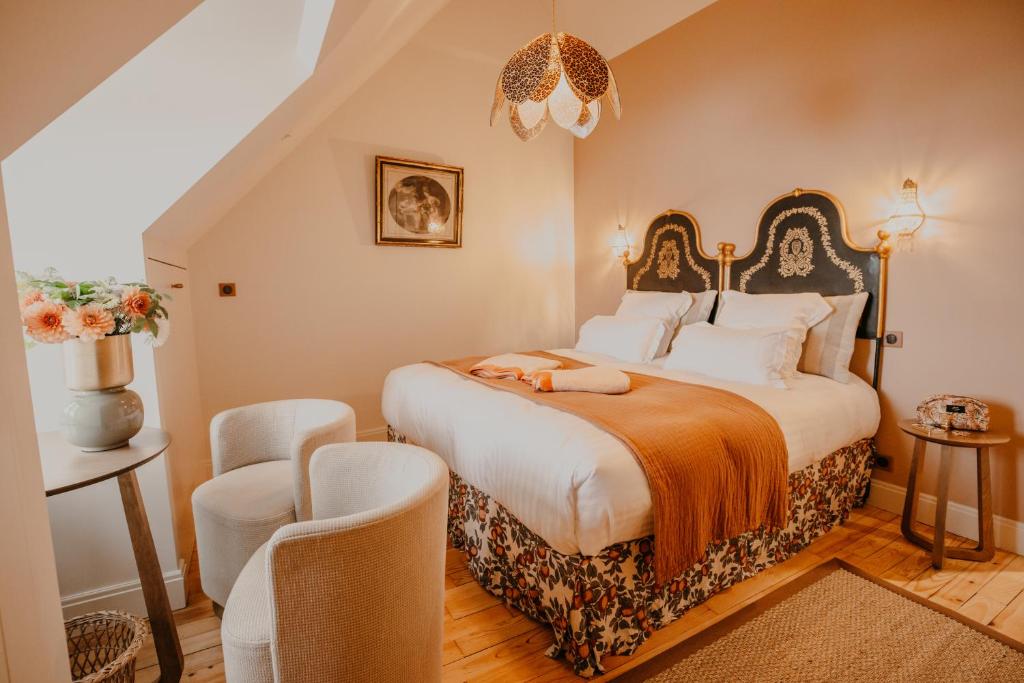 En eller flere senge i et værelse på Gîte de luxe familial vue mer - côte d'Emeraude