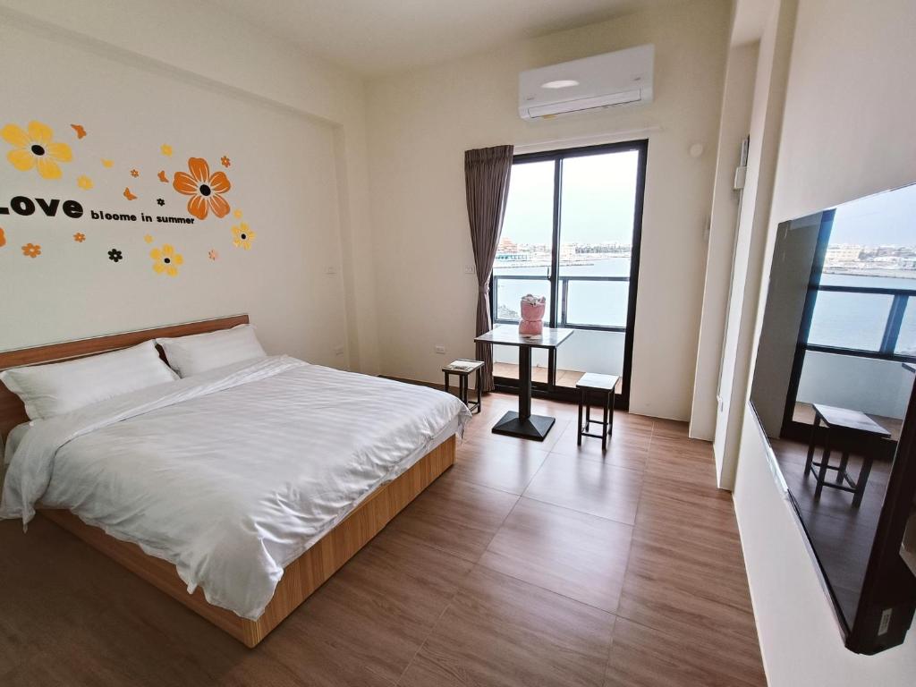 Postel nebo postele na pokoji v ubytování Endless Summer Homestay