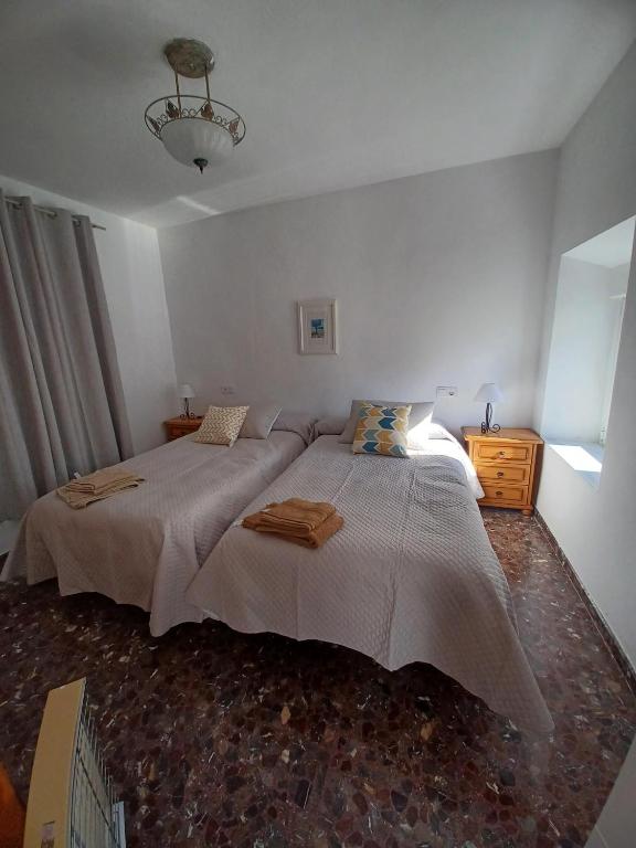 Postel nebo postele na pokoji v ubytování casa del cura