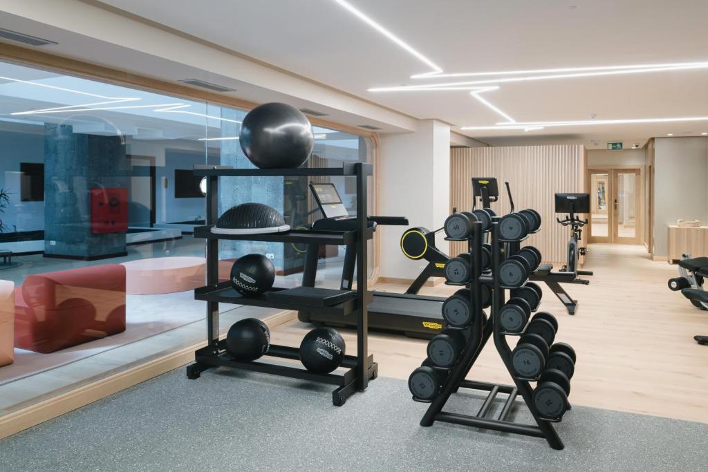 a fitness room with a lot of exercise equipment at Plus Fariones Suite Hotel in Puerto del Carmen