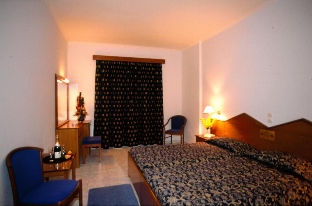Postel nebo postele na pokoji v ubytování Astir Palace Hotel