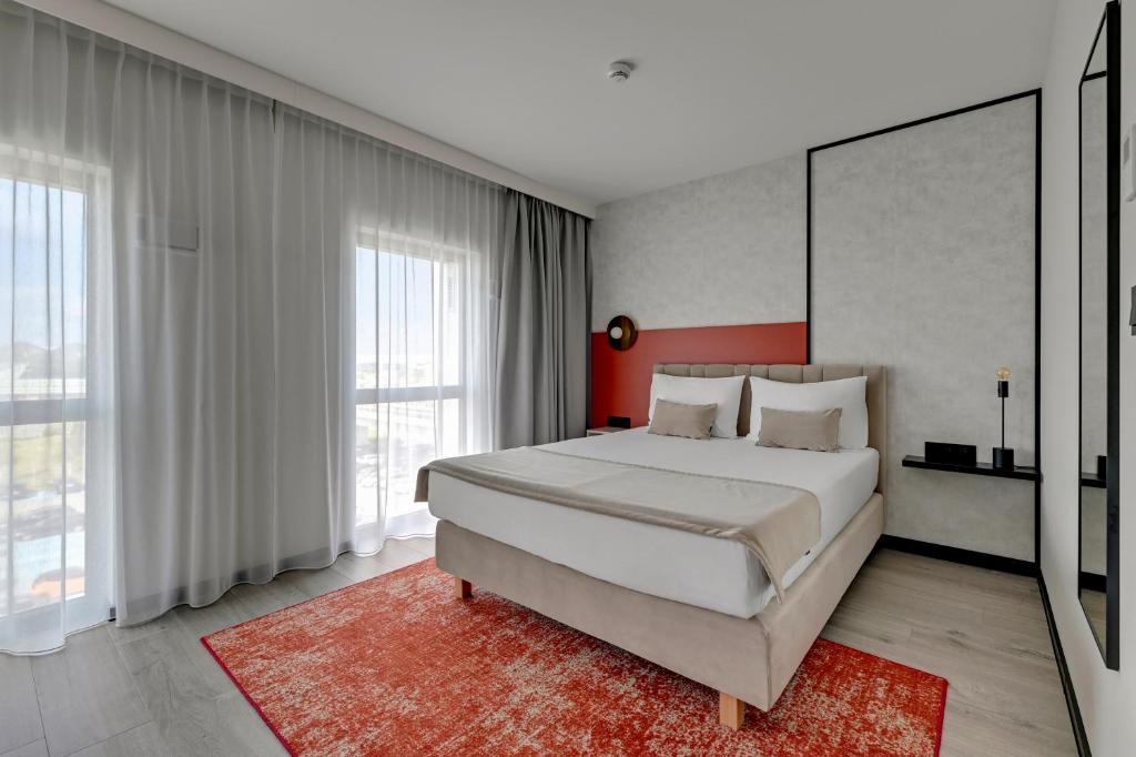 Postel nebo postele na pokoji v ubytování Hotel Milo Gdansk Airport