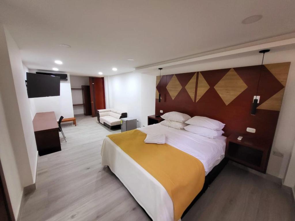 Postel nebo postele na pokoji v ubytování Hotel Victoria Regia Puerto Asís Putumayo