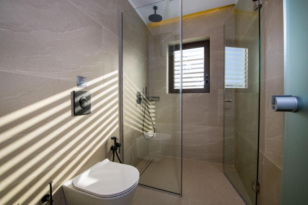 A bathroom at Almi-Cove Hilltop Villas