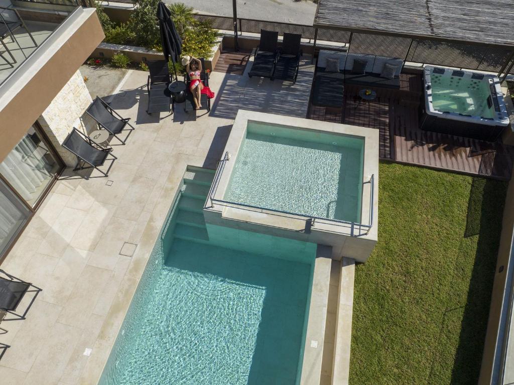 The swimming pool at or close to Almi-Cove Hilltop Villas