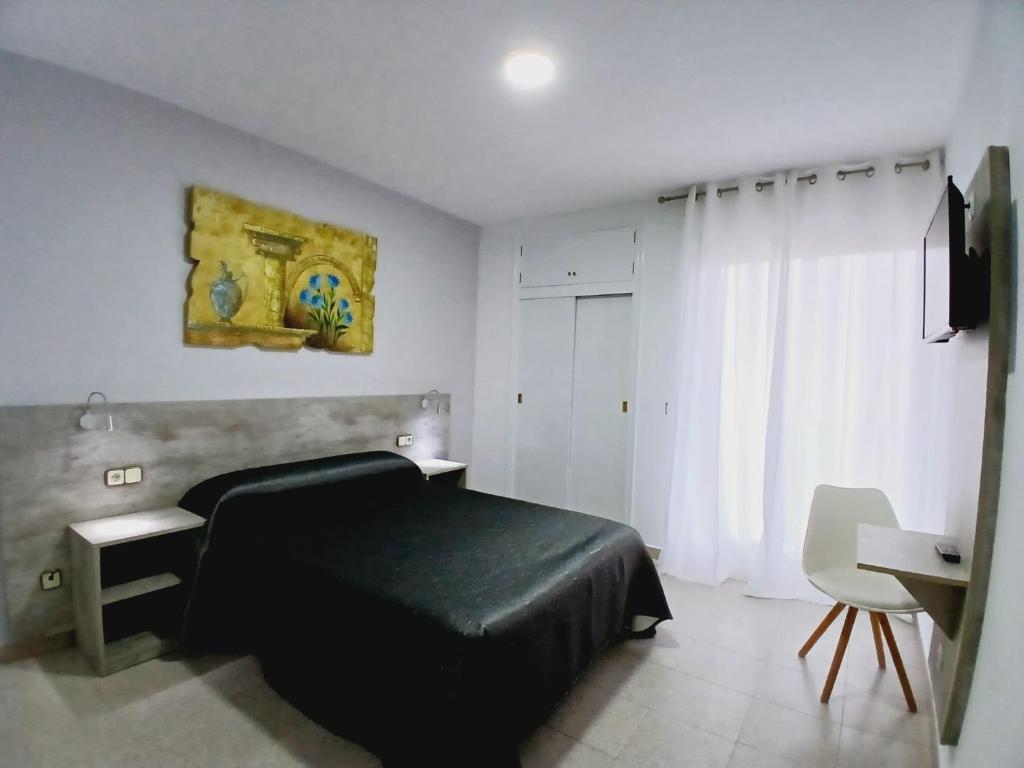 Postel nebo postele na pokoji v ubytování Hotel Congra